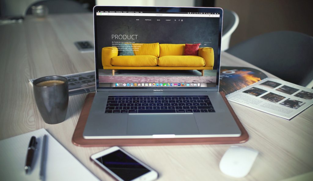 Conquering the Kenyan Digital Frontier: Launching a Thriving E-Commerce Business 2 turned on MacBook Pro beside gray mug