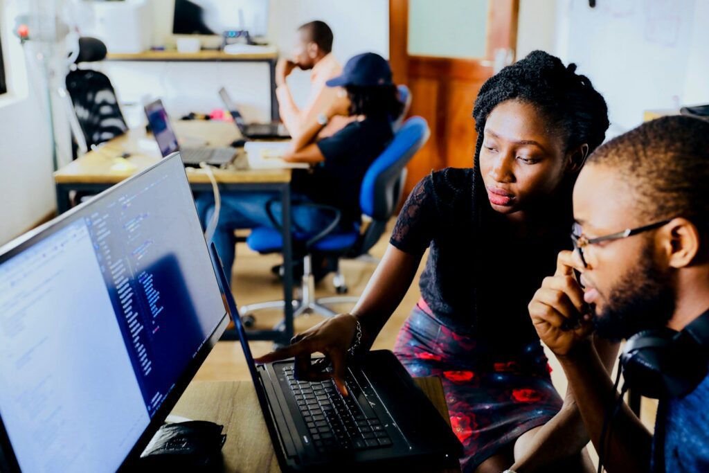 8 Must-Have Tools for Successful Digital Marketing in Kenya 5 woman and man sitting in front of monitor