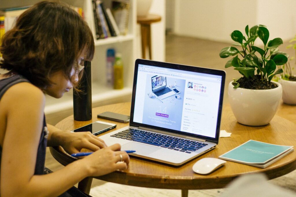 What is the Cost of WordPress Website Design in Kenya? 3 woman browsing on her laptop