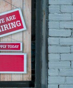 a sign that says we are hiring and apply today
