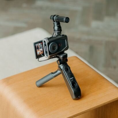 product mounted on tripod functioning on table with all accessories