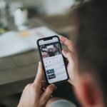 person holding black iphone 4