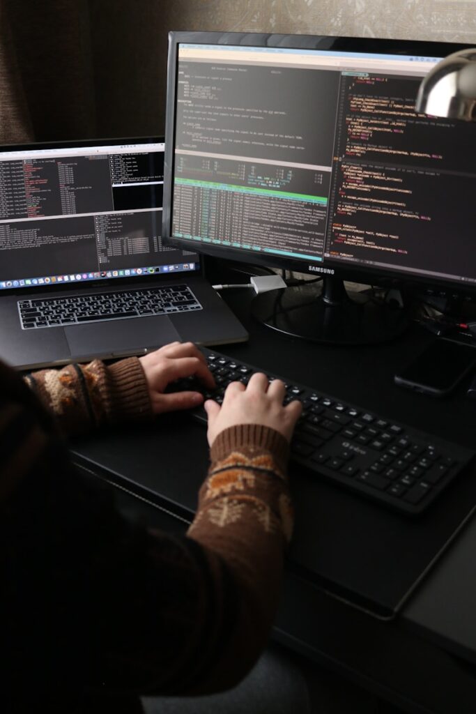 Local Courier vs. China Direct Shipping: What's Best for Your Kenyan Dropshipping Store? 2 a person sitting at a desk with a laptop and a computer monitor