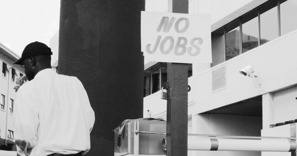 man in white dress shirt standing near white and black camera